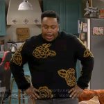 Marty’s black rose print sweater on The Neighborhood