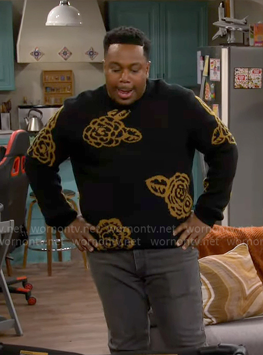 Marty’s black rose print sweater on The Neighborhood