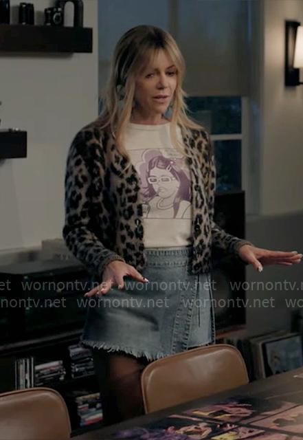 Morgan’s purple graphic t-shirt, denim wrap skirt and sparkly boots on High Potential