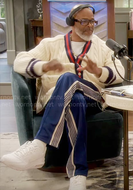 Poppa’s cable-knit cardigan and blue striped pants on Poppas House