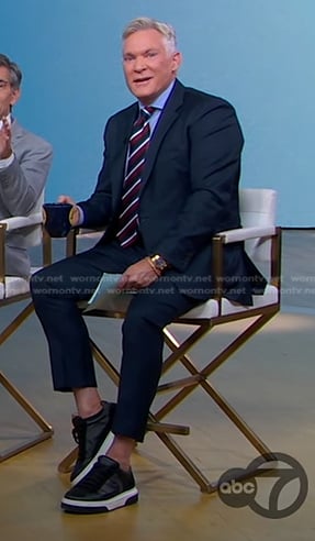 Sam Champion’s black sneakers on Good Morning America