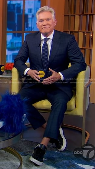 Sam Champion’s black sneakers with white sole on Good Morning America