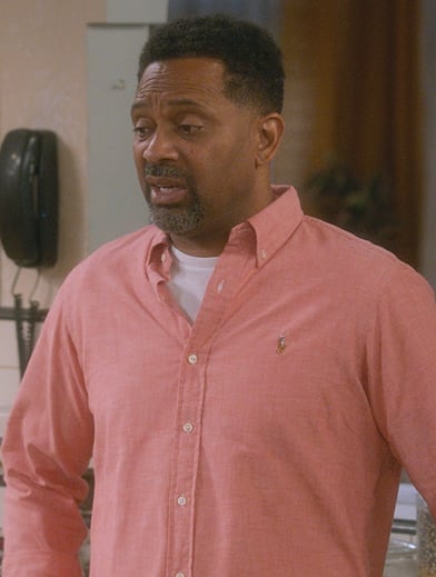 Bennie’s pink logo button down shirt on The Upshaws