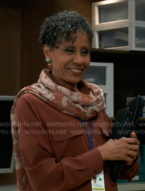 Stella’s rust brown button down shirt and printed scarf on General Hospital