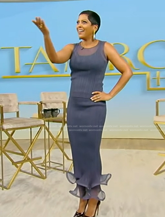 Tamron’s blue sheer top and ruffle hem skirt on Tamron Hall Show