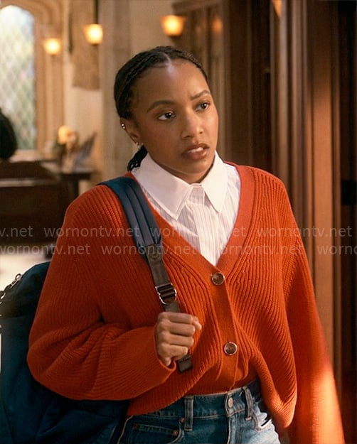 Whitney’s orange v-neck cardigan on The Sex Lives of College Girls