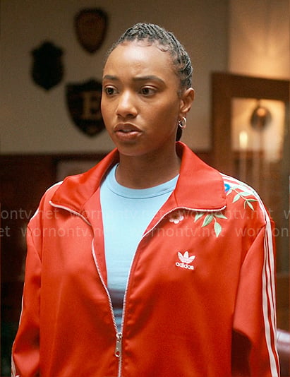 Whitney’s red floral embroidered Adidas jacket on The Sex Lives of College Girls