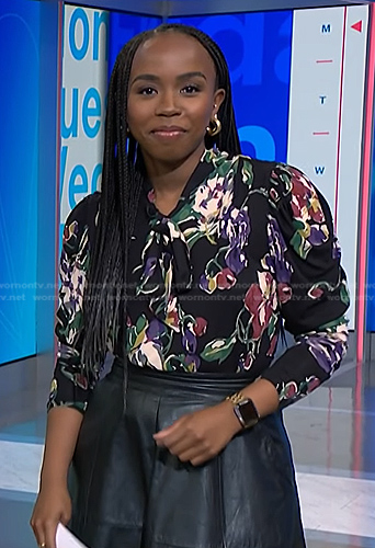 Zinhle’s black floral print tie neck blouse on NBC News Daily