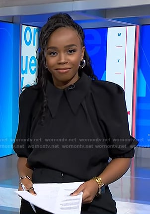 Zinhle’s black collared puff sleeve blouse on NBC News Daily
