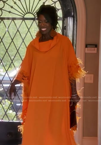 Bozoma’s orange feather trim kaftan dress on The Real Housewives of Beverly Hills