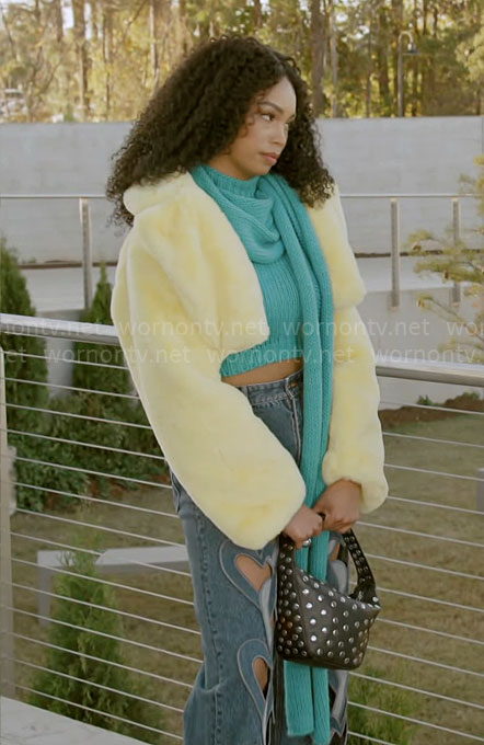 Chelsea’s teal scarf top and heart cutout jeans and yellow fur jacket on Beyond the Gates