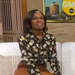 Deborah’s black floral blouse and brown ombre pleated skirt on Good Morning America