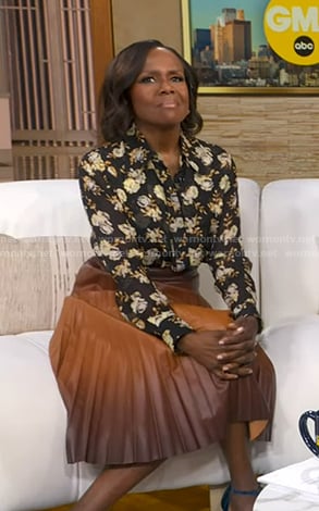 Deborah’s black floral blouse and brown ombre pleated skirt on Good Morning America