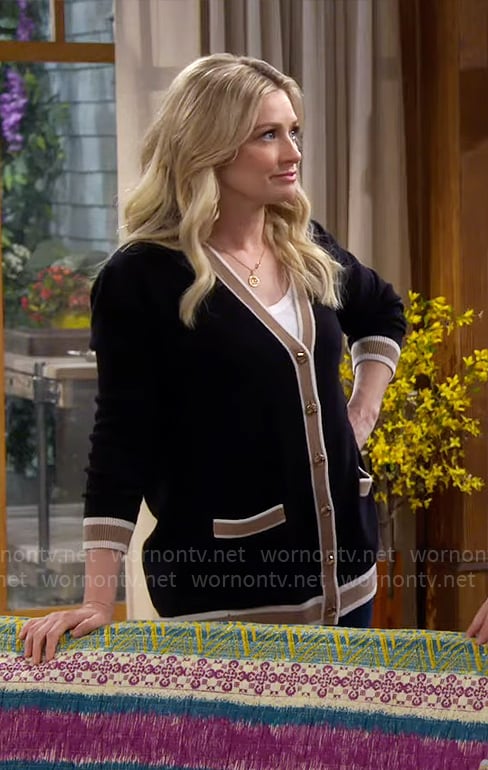Gemma’s black cardigan with camel stripe trim on The Neighborhood