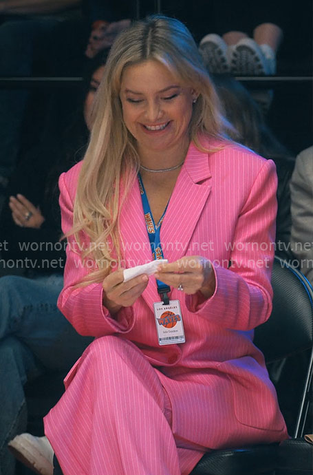 Isla’s pink pinstripe suit on Running Point
