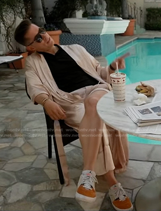 James Longman’s orange and white suede sneakers on Good Morning America