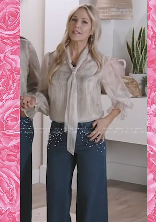 Jennie Garth’s tie neck blouse and embellished jeans on Access Hollywood
