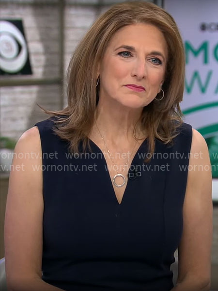 Jill Schlesinger’s navy split-neck dress on CBS Mornings