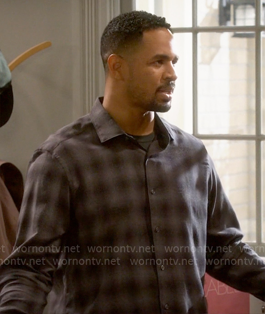 Junior’s grey plaid shirt on Poppas House