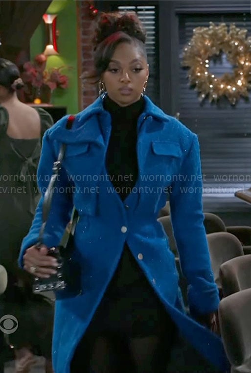 Kat’s blue layered coat on Beyond the Gates