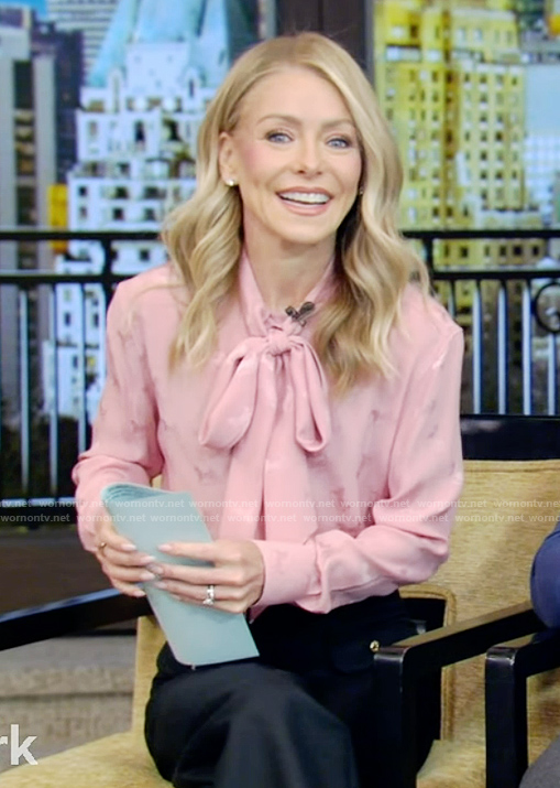 Kelly’s pink tie neck blouse and jeans on Live with Kelly and Mark
