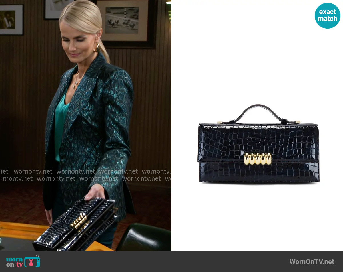 Retrofete Phoebe Clutch worn by Vanessa McBride (Lauren Buglioli) on Beyond the Gates