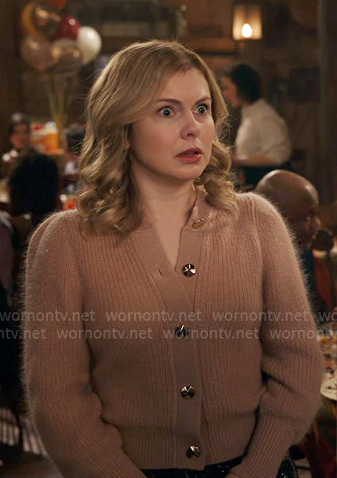 Sam’s cardigan with gold buttons on Ghosts