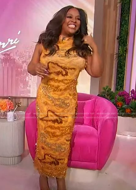 Sherris’ orange embroidered sleeveless dress on Sherri