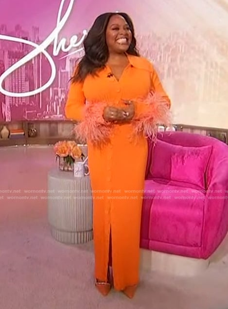 Sherri’s orange feather cuff dress on Sherri