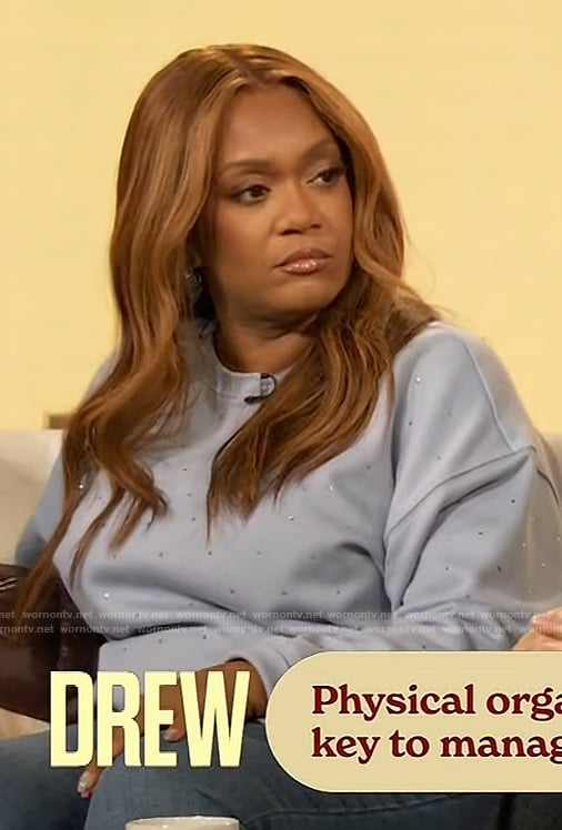 Sunny Anderson’s blue crystal embellished sweatshirt on The Drew Barrymore Show