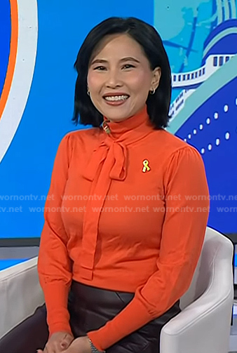 Vicky’s orange tie neck knit top on Today