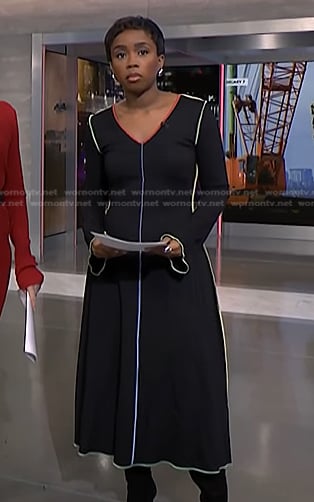 Zinhle’s black dress with multicolor piping on NBC News Daily