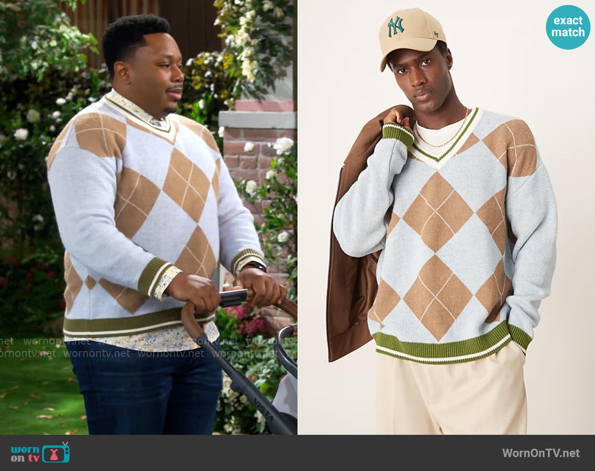 ASOS Design Relaxed knit sweater in blue and brown argyle pattern worn by Marty (Marcel Spears) on The Neighborhood