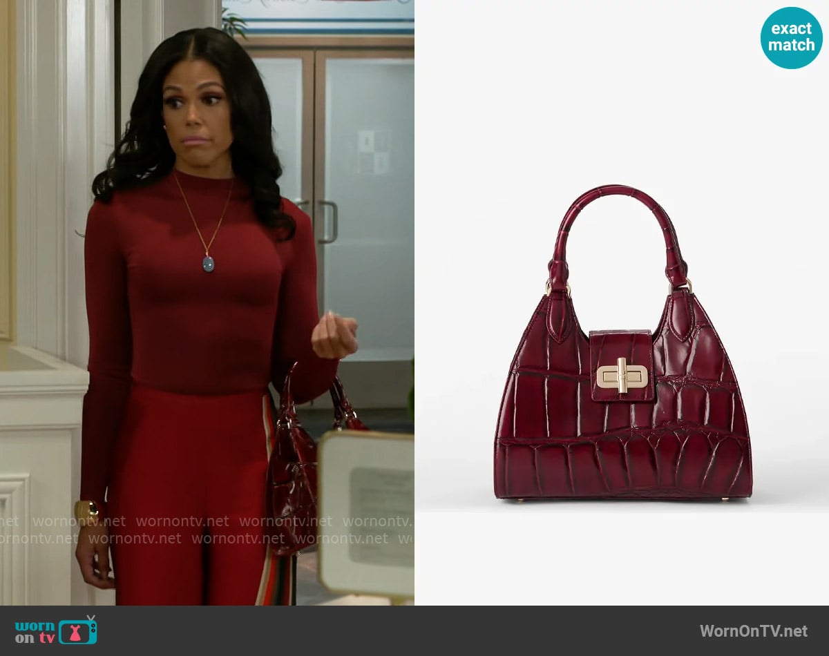 Brahmin Adrian Bag in Merlot Nerina worn by Dani Dupree (Karla Mosley) on Beyond the Gates