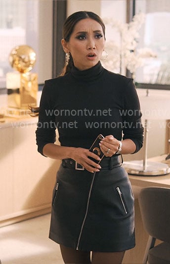 Ali’s black leather mini skirt with zips on Running Point