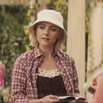 Alice’s black overalls and white floral embroidered bucket hat on Grosse Pointe Garden Society
