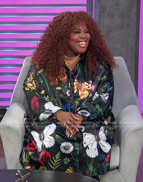 Amber Riley’s black floral print shirt and pants on Access Hollywood