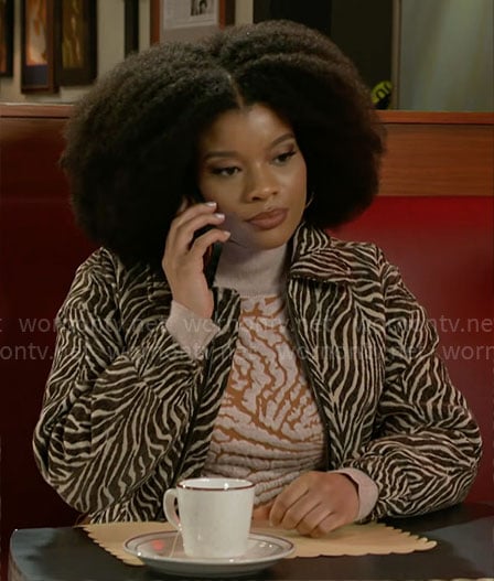Eva’s animal print sweater and jacket on Beyond the Gates