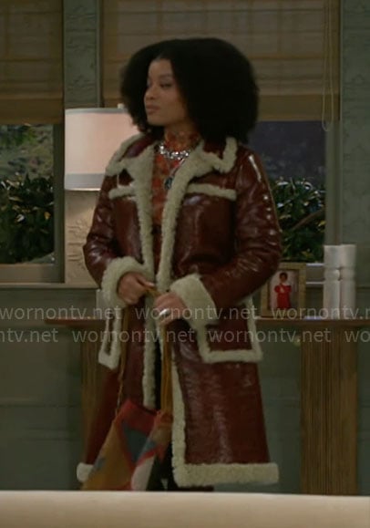 Eva’s leather coat with sherpa trims on Beyond the Gates