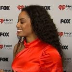 Francesca Amiker’s red satin feather trim dress on E! News