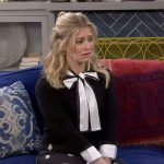 Gemma’s black and white bow neck sweater and printed pants on The Neighborhood