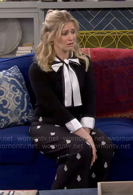 Gemma’s black and white bow neck sweater and printed pants on The Neighborhood
