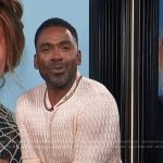 Justin’s pink cable knit sweater on E! News