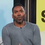 Justin’s gray mesh sweater on E! News