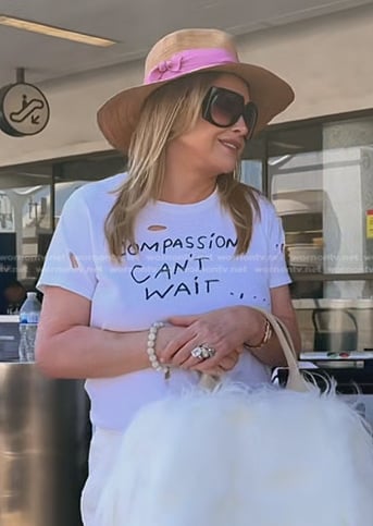 Kathy’s distressed graphic print tee and straw hat on The Real Housewives of Beverly Hills