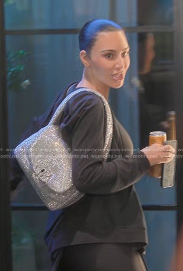 Kim’s silver metallic shoulder bag on The Kardashians