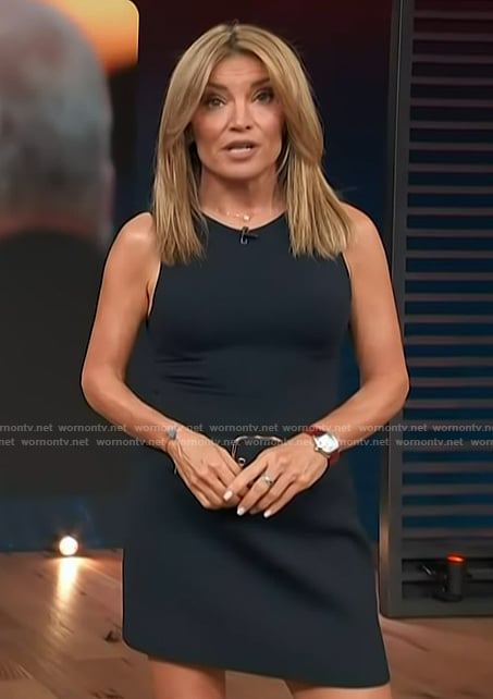Kit’s navy belted mini skirt on Access Hollywood