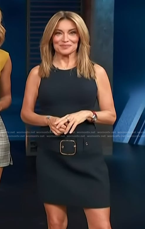 Kit’s navy belted mini skirt on Access Hollywood