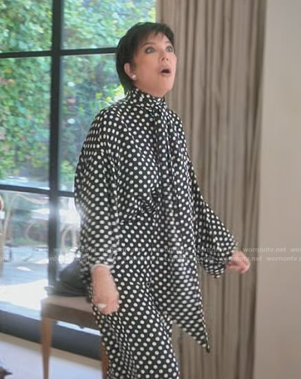 Kris’s black polka dot tie neck blouse on The Kardashians