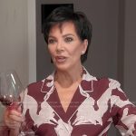 Kris’s burgundy printed feather cuff top on The Kardashians